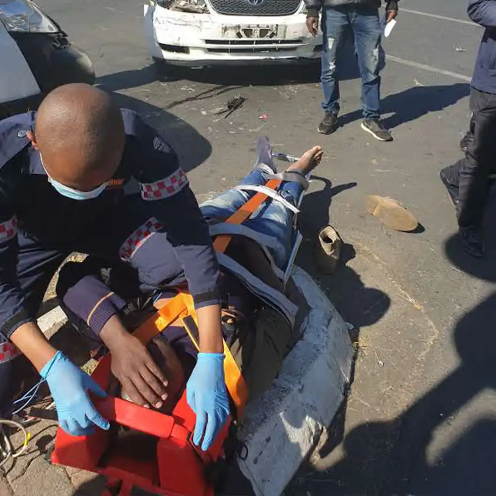 Paramedic providing emergency care after car crash