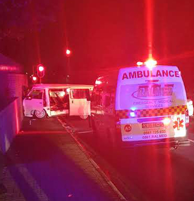 Ambulance responding to night emergency with flashing red lights